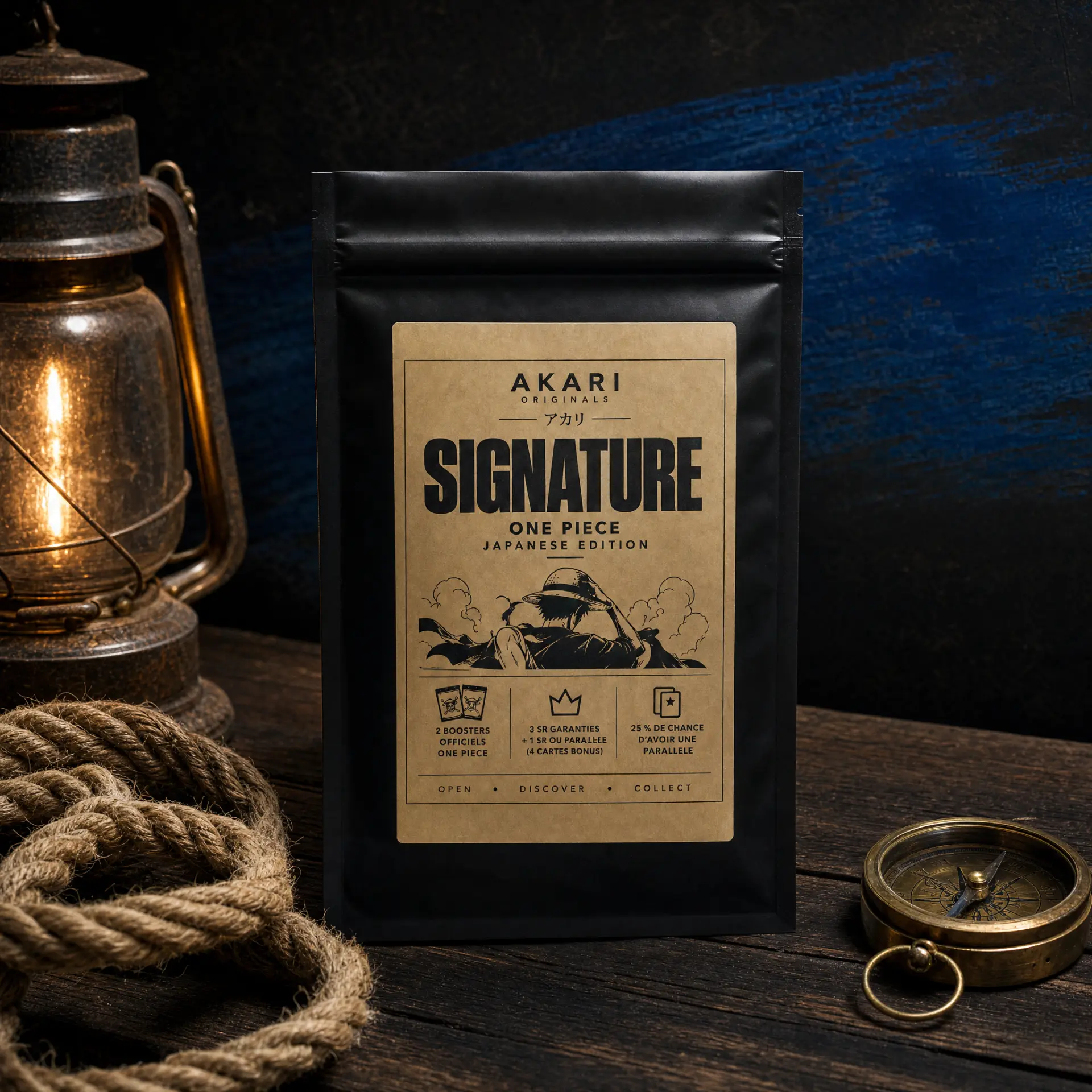 Akari Signature One Piece Japanese Edition — sachet noir à étiquette kraft sur une table en bois, lanterne, corde et boussole
